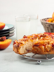 Vegan nectarine peach cake on turquoise table, summer treat