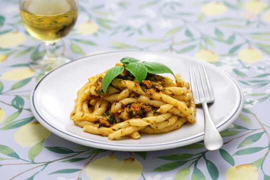 Busiate alla Trapanese is made from a specialty pasta from the province of Trapani called Busiate, then boiling it and tossing it in a Trapanese sauce made primarily from almonds. Italian cuisine.