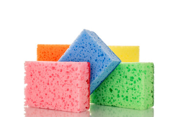 Five kitchen sponges, macro, isolated on white background.