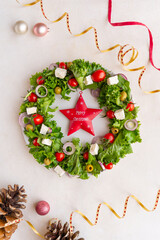 Festive Christmas wreath salad on light background, flat lay