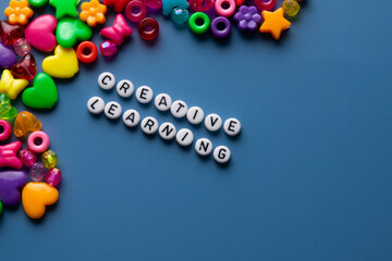 Assorted Beads spelling the words creative and learning