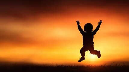 Fototapeta premium Silhouette of a child jumping with a sunset in the background, creating an elegant and vivid glow, minimal and distinct focus