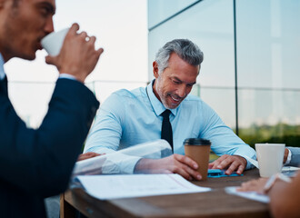 Businessman, meeting and documents with team for corporate infrastructure, planning or development. Happy man, employees or colleagues with paperwork for proposal or business discussion on balcony