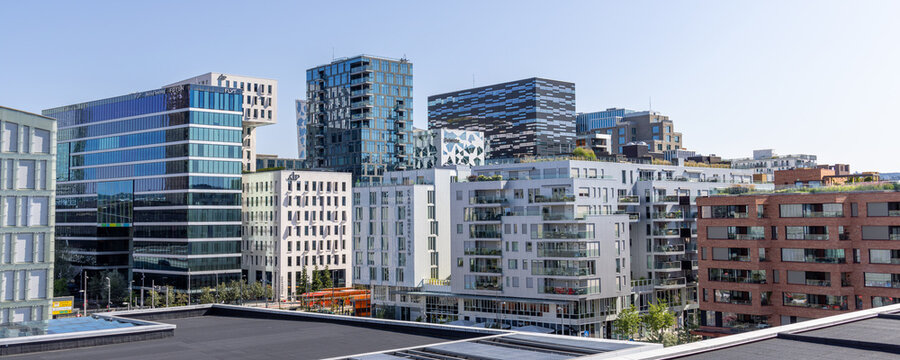 Oslo, Norway - August 2, 2024: Skyline of the buildings of the Barcode Project, part of the Bj&oslash;rvika area of the Fjord City redevelopment in central Oslo as seen from the Oslo Opera House