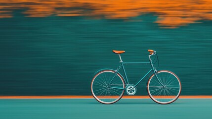 Fototapeta premium A sleek vintage bicycle with an orange saddle is captured in motion against a blurred green and orange background.