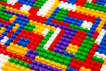Abstract background texture of colored constructor blocks. Background of colorful plastic part of...