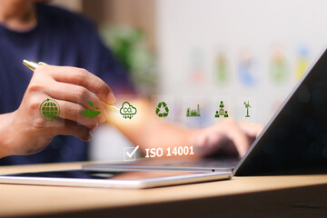 ISO 14001 concept. ISO 14001 certified for environmental management systems (EMS). Identify, control and reduce the environmental impact of activities.
