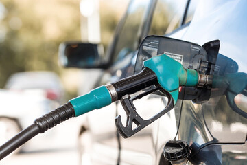 The gas station. Filling the car with gasoline. A Russian fuel dispenser in the fuel tank of a car...
