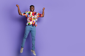 Full size photo of nice young man jump empty space isolated on violet color background