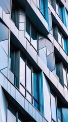 a close-up of a modern architectural facade with various geometric facets, highlighting the building&acirc;&euro;&trade;s design complexity.