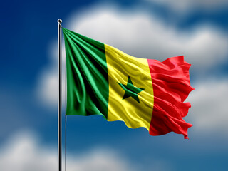 Senegal flag flying on blur blue clouds background.