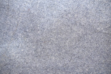 Gray felt texture background. Thick, soft textile material, made of wool, cotton or something else. Rough blanket texture.