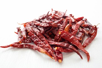 Dried chili pile on white background