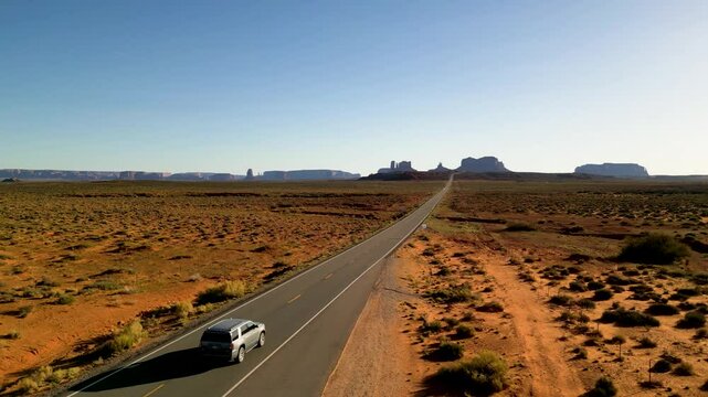 Aerial view of the iconic Monument Valley with the famous Forrest Gump Road stretching through the expansive desert landscape, Oljato Monument Valley, United States.
