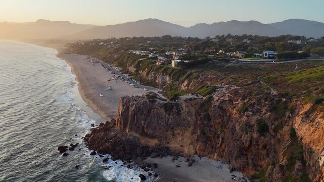 Golden hour flyover: Pt Dume cliff at Malibu Beach sand in California