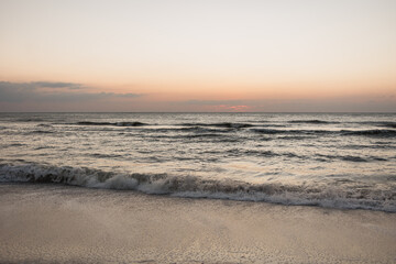 Tranquil Naples, Florida beach at sunset with gentle waves