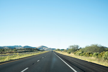 Fototapeta premium Straight shot on a paved two lane road