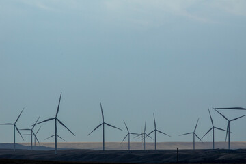 Turbines silhouetted on a wind farm