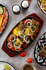 Fried vegetables and meat. Uzbek cuisine.