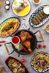 fried chicken on a plate with sauce and vegetables. Uzbek cuisin