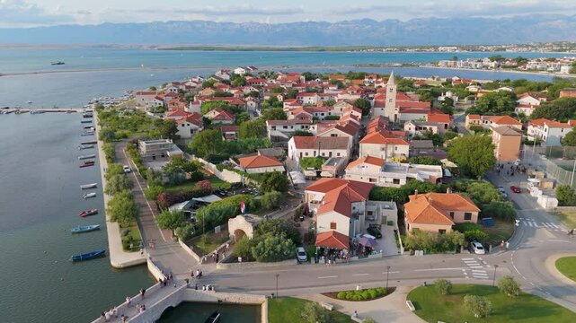 Historic Town of Nin Laguna Aerial View With Velebit Mountain Background, Dalmatia Region of Croatia. Aerial View of Famous Nin Lagoon and Medieval in Croatia Harbour Town With Boats Small Island