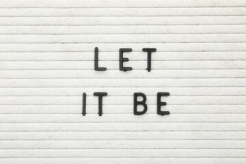 Letter board with phrase Let it be as background, top view
