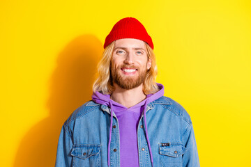 Photo portrait of attractive young man look camera dressed stylish denim clothes isolated on yellow color background