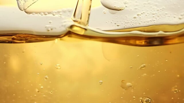 Golden liquid bubbling and forming captivating bubbles