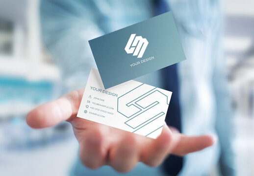 Business Cards Floating Above A Man&rsquo;s Hand Mockup