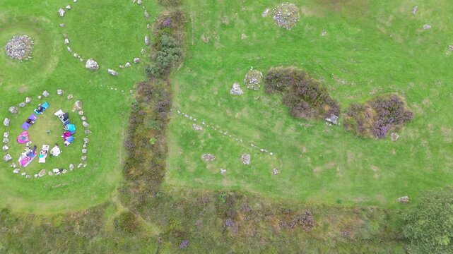 Aerial view of a group of women worshipping at the Beaghmore Stone circles at Blackrock Road by Cookstown in County Tyrone, Northern Ireland