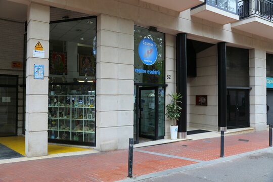 BARCELONA, SPAIN - OCTOBER 8, 2021: Cosmos esoteric shop in Sant Antoni district. It specializes in spiritual products, amulets, charms and books about occult, tarot, parapsychology and metaphysics.