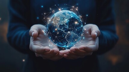 A person holds a glowing digital globe, symbolizing global connectivity and technological advancement in a dark environment