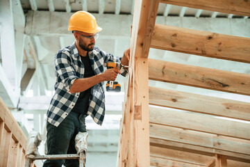 Industrial worker in wooden warehouse