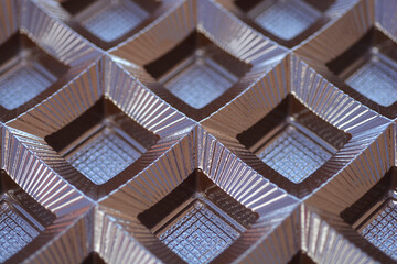 Detail of an empty plastic tray from a box of chocolates where the candies should be