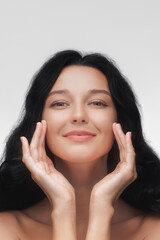 Elegant Woman Touching Her Face for Skincare and Beauty Ads