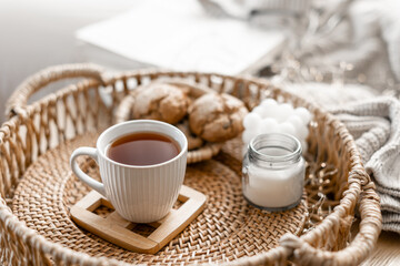 Home coziness composition with a cup of tea. Autumn home comfort.
