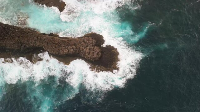 Aerial view of the beautiful rocky coast with crashing waves and turquoise water, Lomo Machin, La Palma, Canary Islands, Spain.