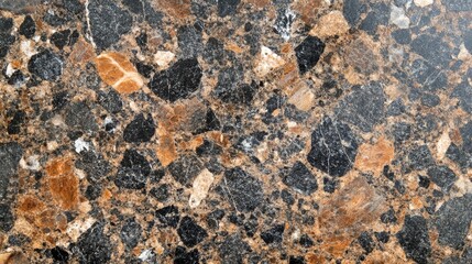 Natural granite surface showcasing unique patterns and textures in shades of brown and black