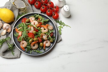 Delicious shrimp salad and ingredients on white marble table, top view. Space for text