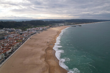Beautiful aerial view of the large Nazare Beach. Portugal