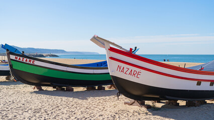 colorful fishing boats made of wood on the beach fishing village Nazare.