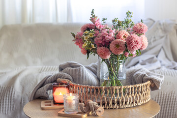 Cozy home interior with flowers dahlias. Autumn home comfort.