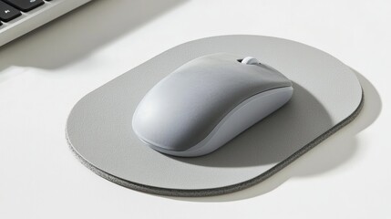 Gray Computer Mouse on Matching Mouse Pad on White Table
