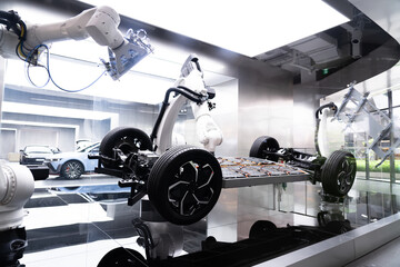 3D rendering of a robotic arm assembling the structure and interior details of an electric car. Automotive and technology industry