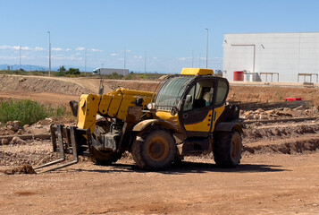 Telescopic handler work on construction site. Forklift Construction machinery for loading. Wheel loader for lifting goods.