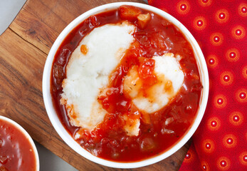 Traditional South African Pap and Sheba sauce or tomato and onion relish