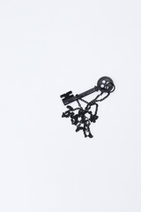 Black key necklace on isolated white background.