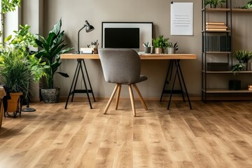 The interior of a bright office room features an empty white poster