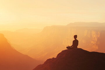 Fototapeta premium A serene scene of a person meditating on a mountaintop at sunrise, with soft, warm light illuminating their peaceful expression, symbolizing mental clarity, mindfulness, and inner peace.