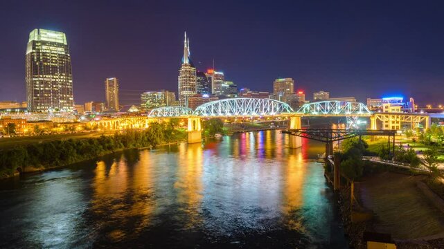 Nashville, Tennessee, USA downtown city skyline at dusk on the Cumberland River.